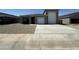Contemporary single-Gathering home featuring a two-car garage and xeriscaped front yard at 47230 W Cansados Rd, Maricopa, AZ 85139