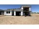 New home with garage under construction showing unfinished exterior and roof tiles at 47230 W Cansados Rd, Maricopa, AZ 85139
