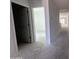 Hallway with white walls leads to bright rooms in a newly constructed home at 47230 W Cansados Rd, Maricopa, AZ 85139