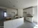Kitchen featuring modern white cabinetry, an island, and recessed lighting at 47230 W Cansados Rd, Maricopa, AZ 85139