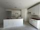 Kitchen featuring modern white cabinetry, ample storage space, and a central island at 47230 W Cansados Rd, Maricopa, AZ 85139