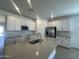 Bright kitchen featuring stainless steel appliances, ample cabinet space, and modern finishes at 47230 W Cansados Rd, Maricopa, AZ 85139