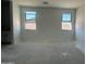 An unfurnished room with two bright windows at 47230 W Cansados Rd, Maricopa, AZ 85139