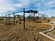 Swings and playground provide residents with hours of fun within the community at 47230 W Cansados Rd, Maricopa, AZ 85139