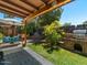 Backyard featuring mature landscaping, covered patio, barbecue, and swing at 5517 W Commonwealth Pl, Chandler, AZ 85226