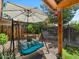 Secluded backyard features a charming porch swing, offering a perfect spot for relaxation and enjoying the outdoors at 5517 W Commonwealth Pl, Chandler, AZ 85226