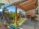 Private backyard patio with cozy seating, a hot tub, and lush greenery for a serene outdoor experience at 5517 W Commonwealth Pl, Chandler, AZ 85226