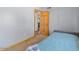 Spare bedroom featuring a trundle bed, closet, doorway, and neutral decor at 5517 W Commonwealth Pl, Chandler, AZ 85226