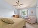 Relaxing bedroom with a high ceiling, comfy bed, a window, and a cozy armchair at 5517 W Commonwealth Pl, Chandler, AZ 85226