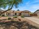 Charming single-story home with a well-manicured front yard and a cozy curb appeal at 5517 W Commonwealth Pl, Chandler, AZ 85226