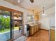 Cozy kitchen with wooden cabinets and a view to an outdoor patio at 5517 W Commonwealth Pl, Chandler, AZ 85226