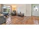 Comfortable living room featuring a large sectional couch and beautiful tile flooring at 5517 W Commonwealth Pl, Chandler, AZ 85226
