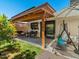 Inviting covered patio with comfortable seating, ideal for outdoor relaxation and enjoying the garden view at 5517 W Commonwealth Pl, Chandler, AZ 85226