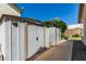 Backyard with two outdoor storage sheds with light tan trim at 6018 W Villa Maria Dr, Glendale, AZ 85308