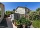 Charming backyard featuring a garden, storage sheds, and well-maintained surroundings at 6018 W Villa Maria Dr, Glendale, AZ 85308
