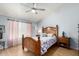 Comfortable bedroom with a decorative wood frame bed and matching nightstands at 6018 W Villa Maria Dr, Glendale, AZ 85308