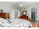 Spacious bedroom with a bed, dresser, and an en-suite bathroom view at 6018 W Villa Maria Dr, Glendale, AZ 85308