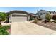Charming single-story home with mature landscaping and a two car garage at 6018 W Villa Maria Dr, Glendale, AZ 85308