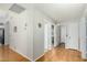 Hallway with wood laminate flooring and white doors at 6018 W Villa Maria Dr, Glendale, AZ 85308