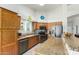 Well-equipped kitchen with wood cabinets, granite countertops, stainless steel appliances at 6018 W Villa Maria Dr, Glendale, AZ 85308
