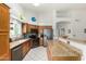 Well-equipped kitchen with wood cabinets, granite countertops, stainless steel appliances and island at 6018 W Villa Maria Dr, Glendale, AZ 85308