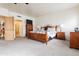 Spacious main bedroom boasts neutral carpeting, natural light and wood accents at 6411 S River Dr # 28, Tempe, AZ 85283