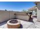 Backyard area with a patio area that includes a built-in grill and fire pit for outdoor enjoyment at 6742 W El Cortez Pl, Peoria, AZ 85383