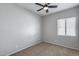 Empty bedroom showcasing neutral walls, carpet and a ceiling fan at 6742 W El Cortez Pl, Peoria, AZ 85383