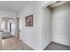 Hallway featuring tiled floors, and a lovely piece of floral art hanging on the wall at 6742 W El Cortez Pl, Peoria, AZ 85383