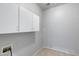Laundry room with convenient upper cabinetry, offering practical storage solutions at 6742 W El Cortez Pl, Peoria, AZ 85383