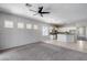 Spacious living room featuring an open floor plan and seamless transition to the kitchen at 6742 W El Cortez Pl, Peoria, AZ 85383