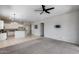 Open-concept living area with a kitchen view, perfect for entertaining and everyday living at 6742 W El Cortez Pl, Peoria, AZ 85383