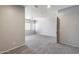 Large living area with neutral carpeting, a ceiling fan, and plenty of natural light at 6742 W El Cortez Pl, Peoria, AZ 85383