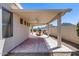 Covered patio has an outdoor kitchen, concrete tile flooring, and views of the mountains at 6742 W El Cortez Pl, Peoria, AZ 85383
