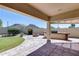 Outdoor patio features a built-in grill, a fire pit, and mountain views at 6742 W El Cortez Pl, Peoria, AZ 85383