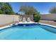 Serene swimming pool with a stone tile, accent wall, and patio area for relaxing in style at 6742 W El Cortez Pl, Peoria, AZ 85383