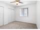 A bright bedroom with carpet, a ceiling fan and a window with wood blinds at 7110 E Continental Dr # 2008, Scottsdale, AZ 85257