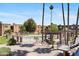 The community pool has an adjacent trellis covered BBQ area and tropical landscaping at 7110 E Continental Dr # 2008, Scottsdale, AZ 85257