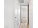Hallway with tile flooring leads to bedrooms and has storage on the right at 7110 E Continental Dr # 2008, Scottsdale, AZ 85257