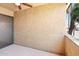 This condo patio has a textured stucco wall, fan, and views of the neighborhood at 7110 E Continental Dr # 2008, Scottsdale, AZ 85257