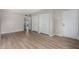 Open bedroom space with fresh paint and light wood-look flooring, as well as a double closet at 7220 E Edgewood Ave, Mesa, AZ 85208