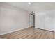 Bedroom featuring a ceiling fan, a large closet with sliding doors, and wood flooring throughout at 7220 E Edgewood Ave, Mesa, AZ 85208