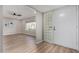 Bright entryway featuring wood-look floors, a glass block accent, and views into the living room at 7220 E Edgewood Ave, Mesa, AZ 85208
