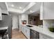 Modern kitchen featuring white cabinets, stainless steel appliances, and quartz countertops at 7220 E Edgewood Ave, Mesa, AZ 85208
