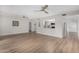 Spacious living room with wood-look floors and views into the kitchen, entry, and other living spaces at 7220 E Edgewood Ave, Mesa, AZ 85208