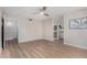 Large main bedroom with ceiling fan, wood floor, and doorways to an ensuite bathroom and walk in closet at 7220 E Edgewood Ave, Mesa, AZ 85208