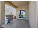 Covered patio with a barbecue grill and sliding door access to the home at 7236 W Townley Ave, Peoria, AZ 85345