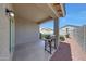 Covered patio with a barbecue grill and a view of the well-maintained backyard at 7236 W Townley Ave, Peoria, AZ 85345