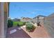 Backyard with a seating area, green grass, string lights and mature landscaping at 7236 W Townley Ave, Peoria, AZ 85345