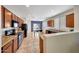 Bright kitchen with wood cabinets, tile flooring, and an open layout, perfect for cooking and entertaining at 7236 W Townley Ave, Peoria, AZ 85345
